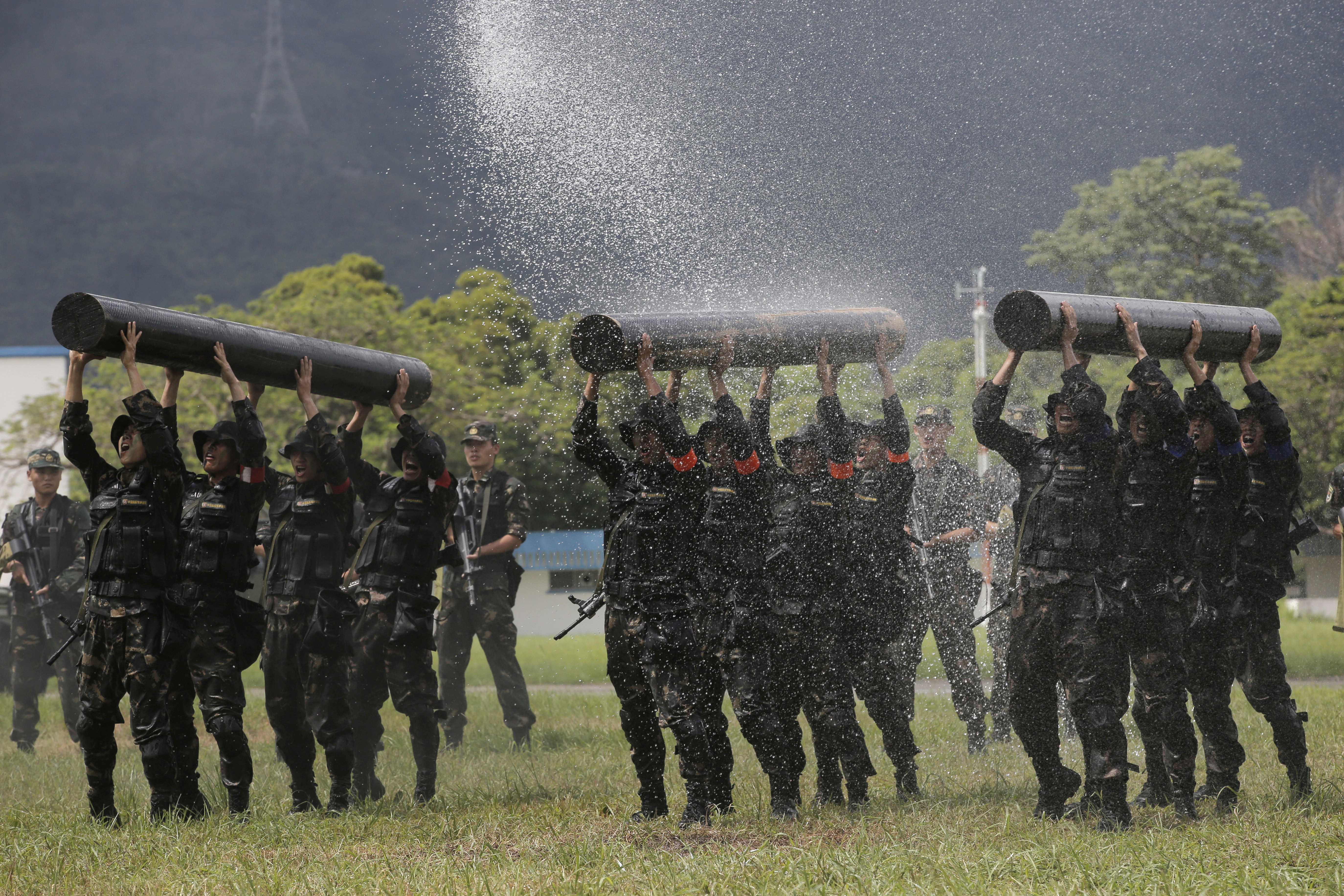 FILE - Chinese soldiers based in Hong Kong demonstrate their skill at the Shek Kong barracks of People's Liberation Army (PLA) Garrison during an open day to celebrate the upcoming 21st anniversary of the city's return to Chinese sovereignty from British rule in Hong Kong on June 30, 2018. 