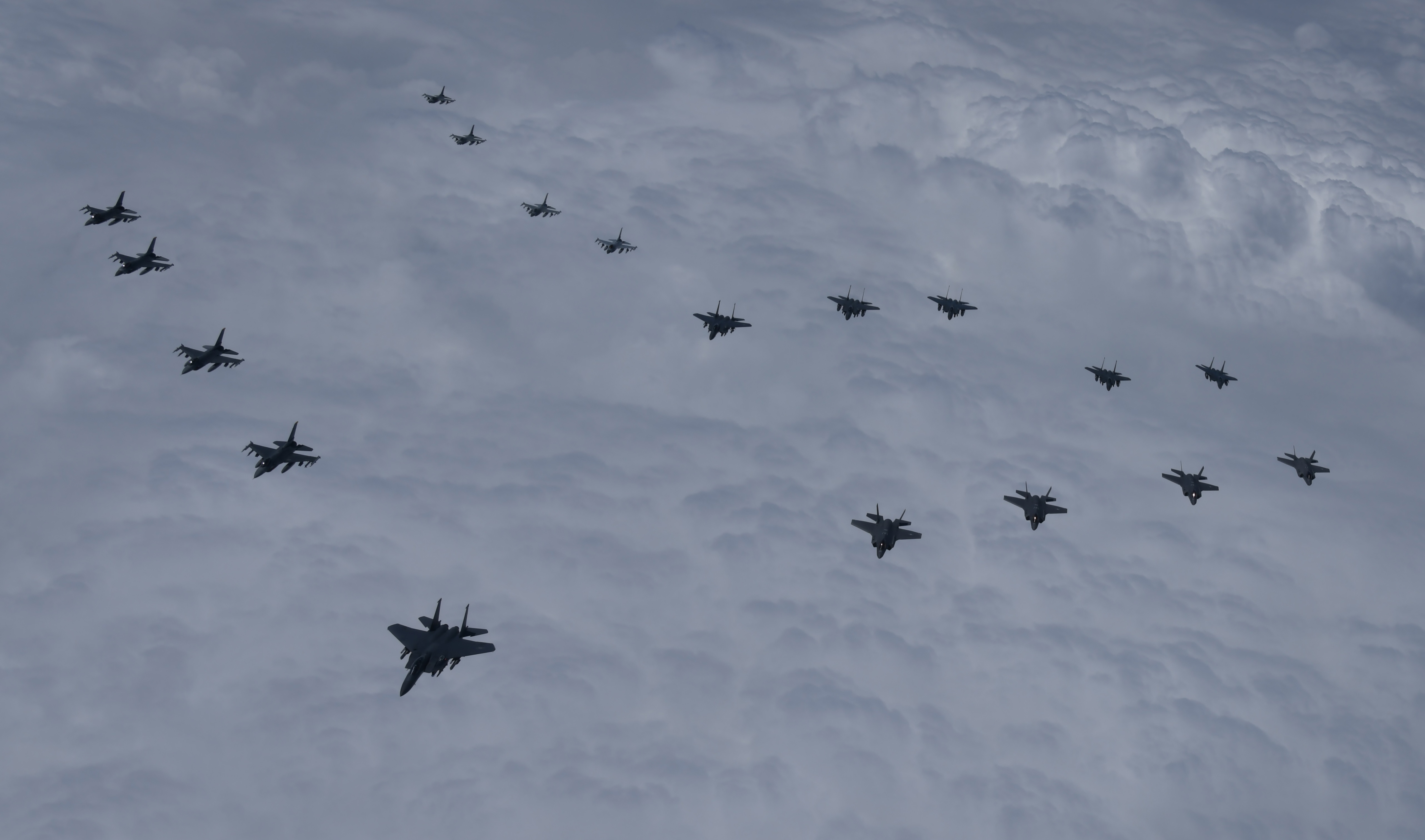 In this photo provided by South Korea Defense Ministry, U.S. and South Korea Air Force fighter jets including South Korea's F-35A stealth fighters and U.S. F-16 fighter jets, fly in formation during a joint drill on Tuesday, June, 7, 2022. 