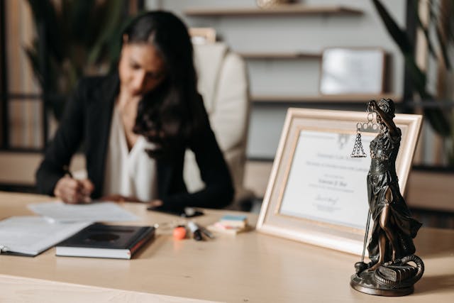 Photo by Pavel Danilyuk: https://www.pexels.com/photo/lady-justice-figurine-on-wooden-table-8111865/