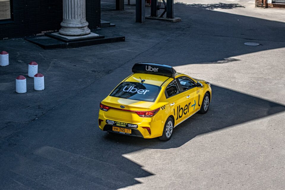 Photo by Aleksandr Sochnev: https://www.pexels.com/photo/yellow-uber-taxi-on-urban-street-30463342/